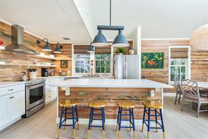 Amazing chef kitchen in open concept living and dining area.