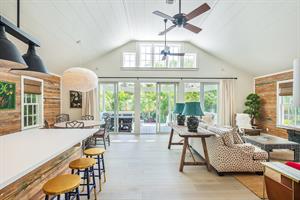 The kitchen and living room flow into the gorgeous backyard