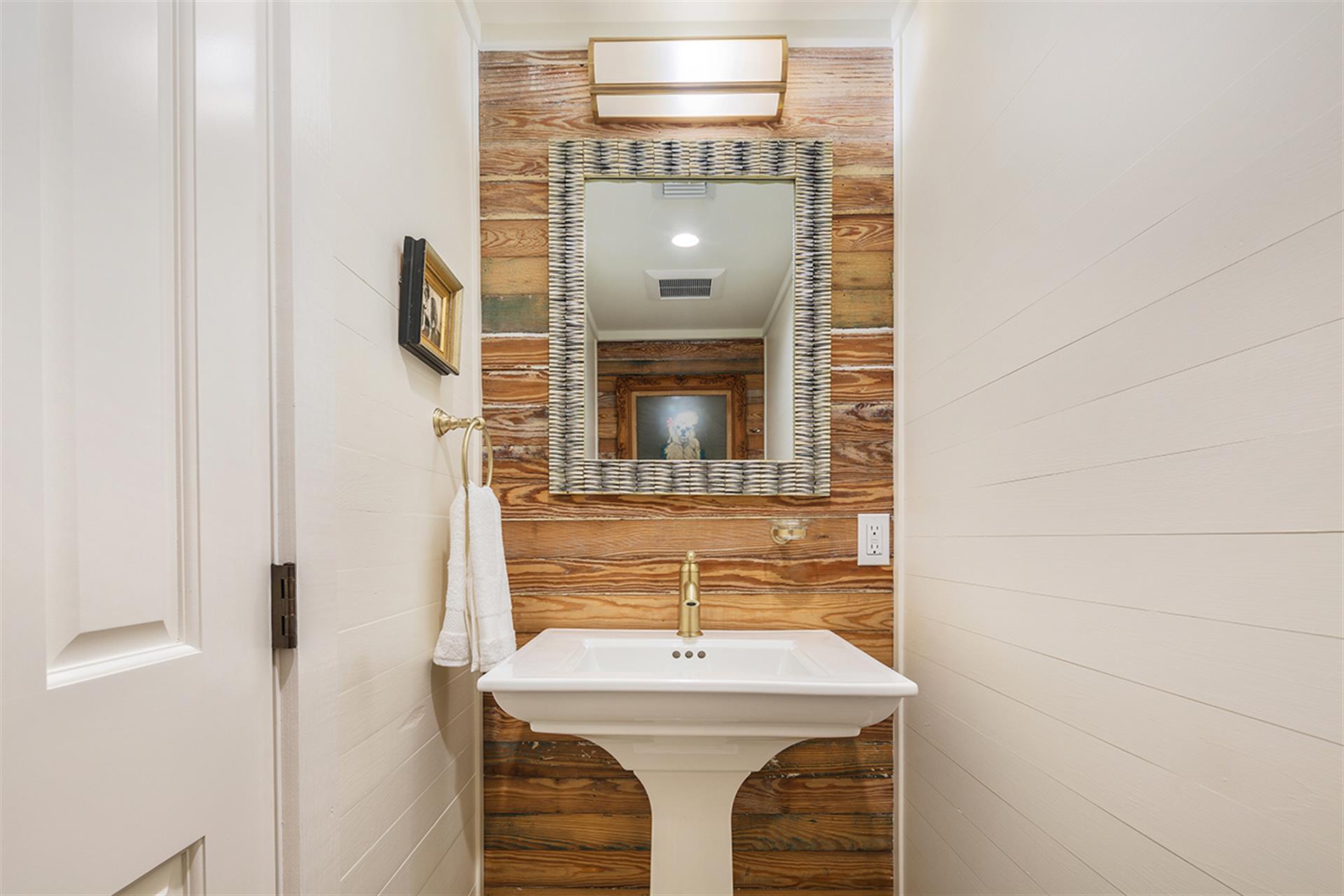 Powder room is located just off the kitchen area.