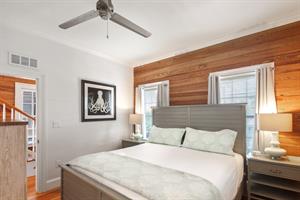 Downstairs bedroom includes comfy king bed