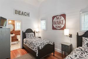 Twin bedroom with vaulted ceiling and ensuite bath