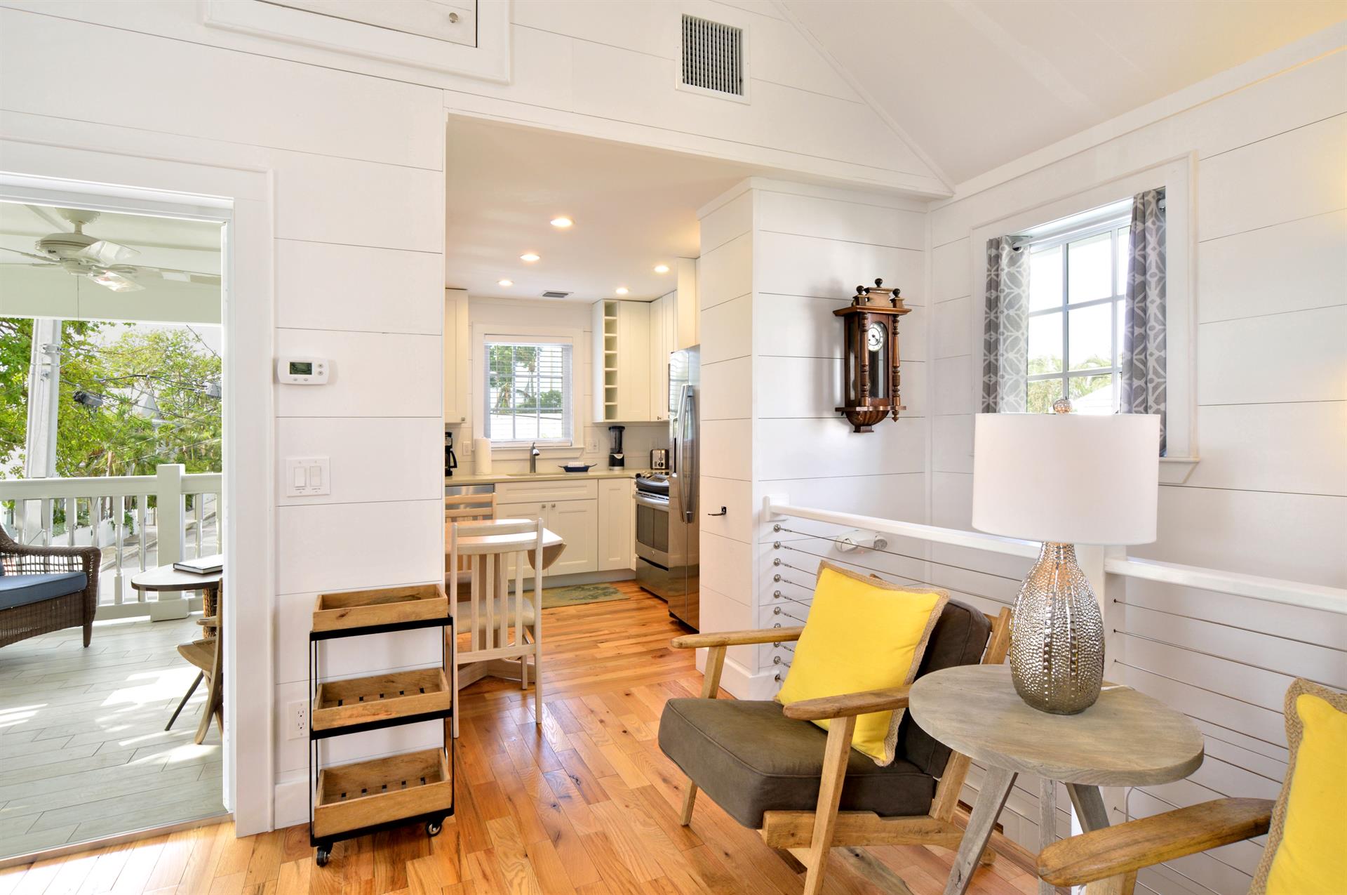 View of balcony access, left, and kitchen entrance, right.