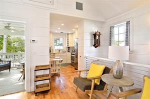 View of balcony access, left, and kitchen entrance, right.