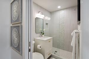 Walkin glass shower in the second floor bath.