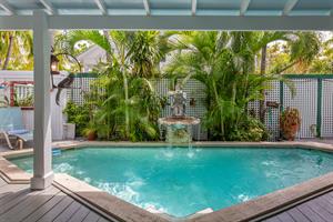 Heated pool lies just a few steps from the living room