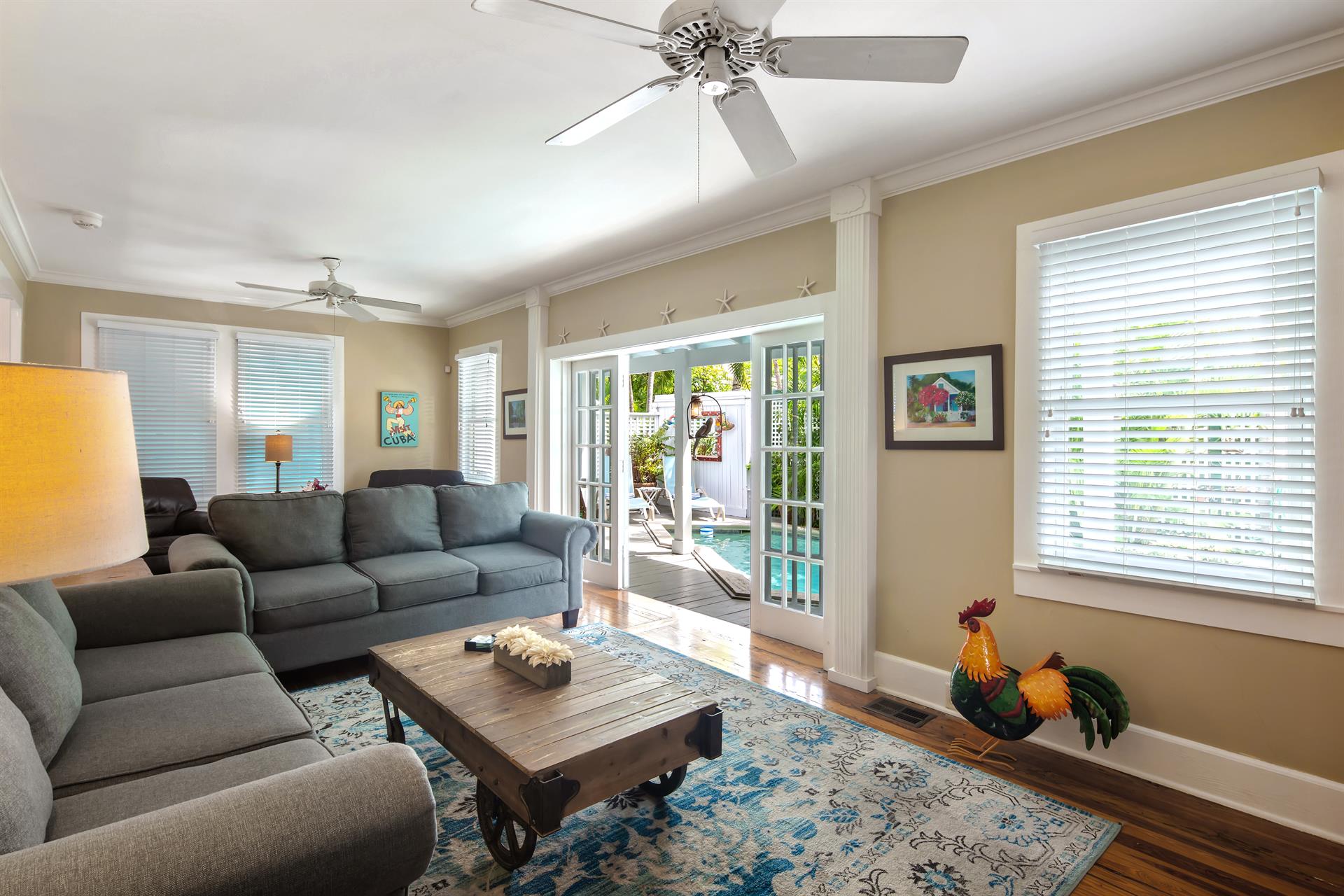 Large windows and French doors offer ample natural light