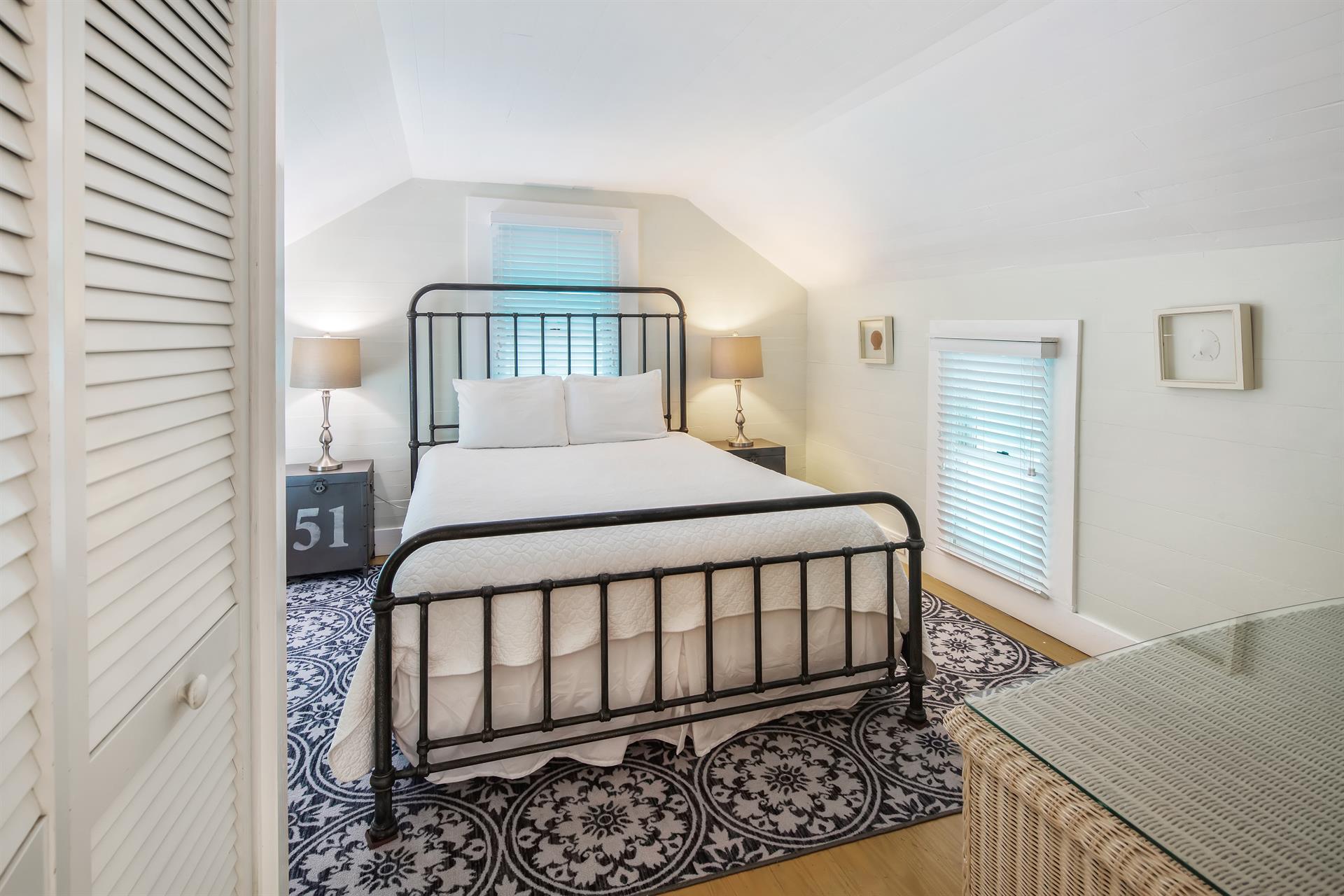 Queen bedroom with bedside lighting
