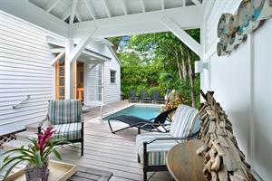 Breezy poolside cabana, private pool with water feature.