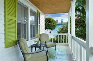 Front porch is located off of the first floor primary suite.