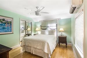 Comfy king bed and ample closet space in Rooster Conch. note former queen bed shown