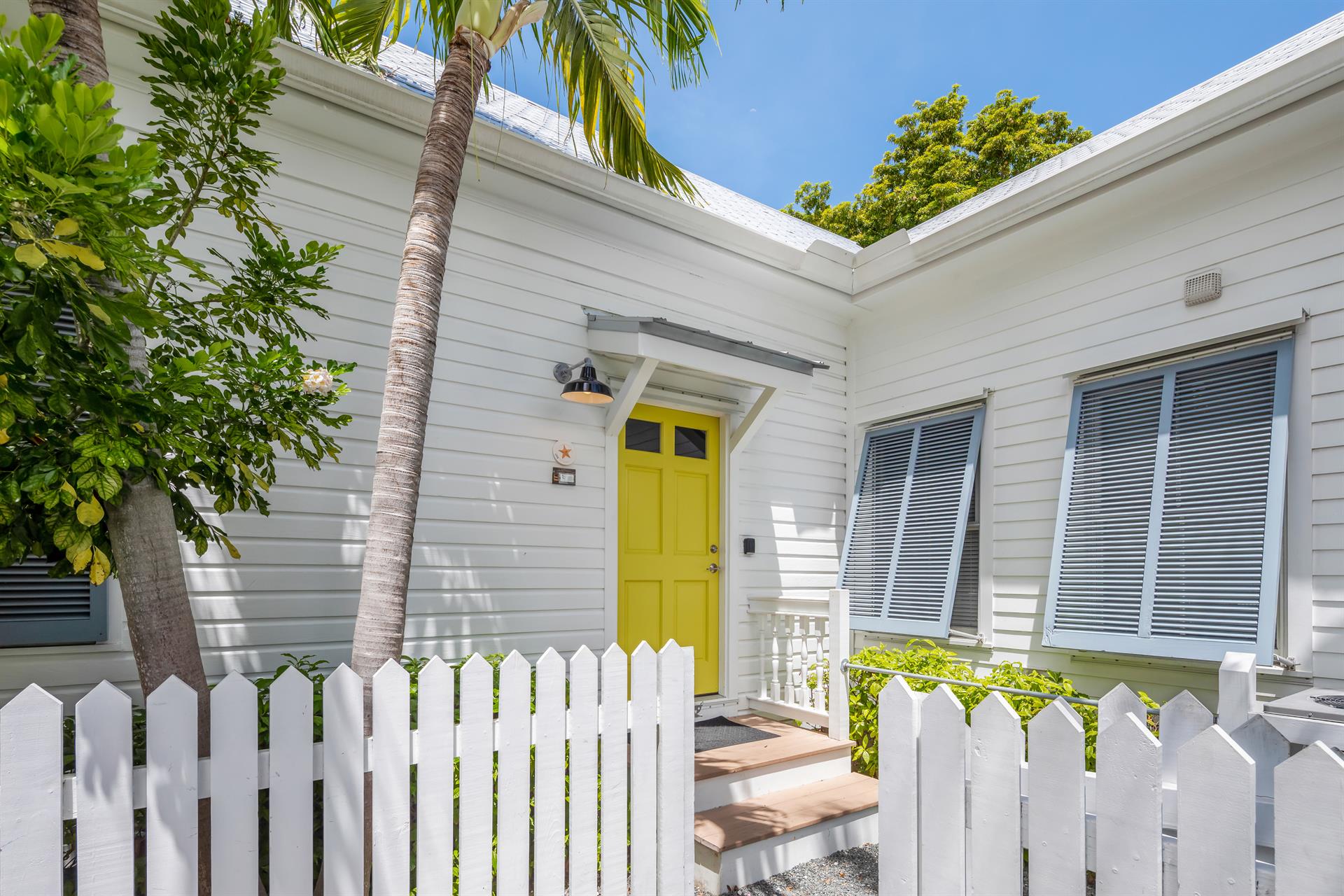 Enter through the sunny yellow door.