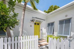 Enter through the sunny yellow door.