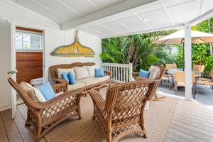 Spacious covered lanai with powder room for convenience.