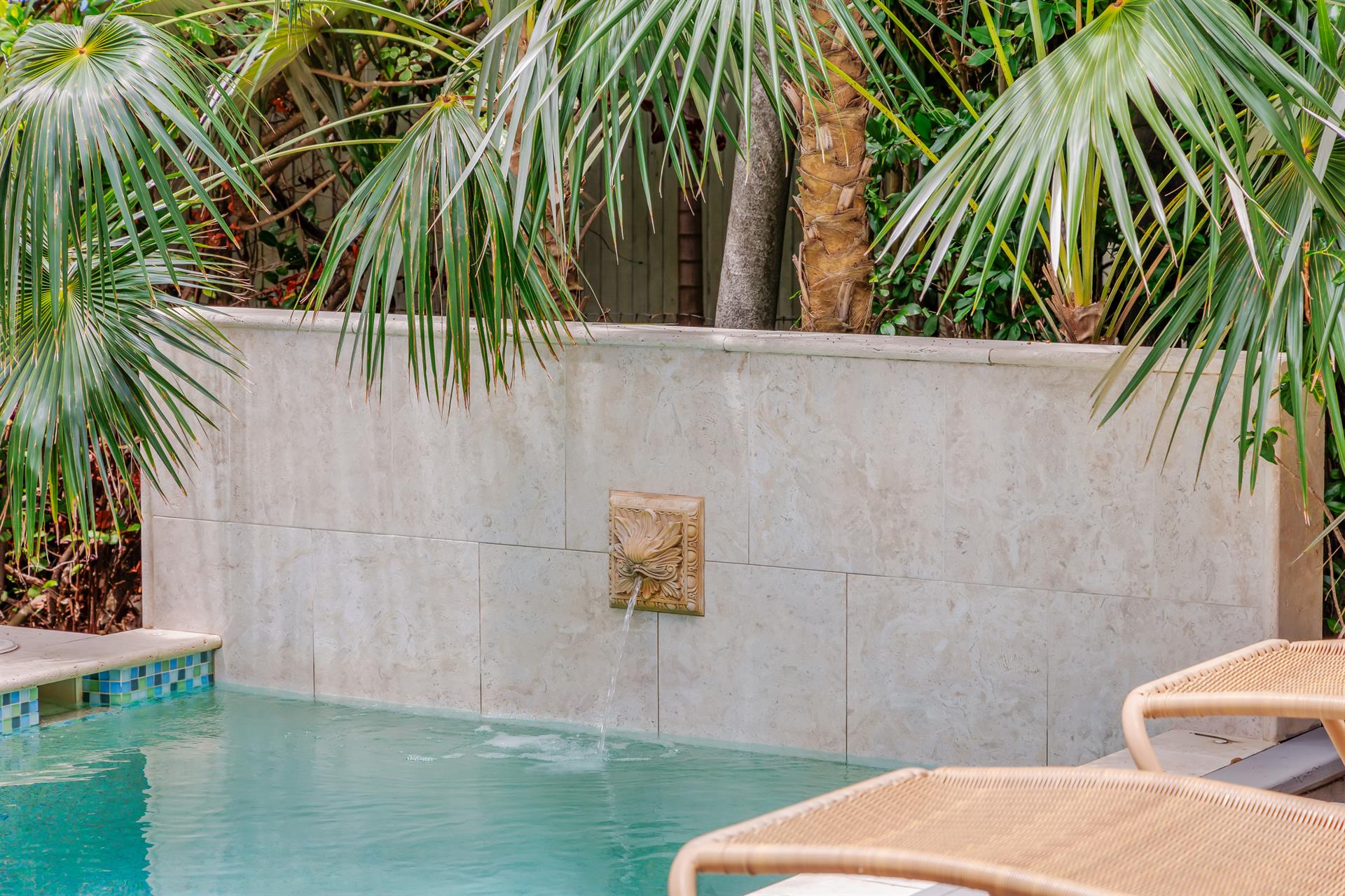 Relaxing water feature in your private pool.