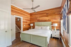 King bedroom with ensuite bath and porch access