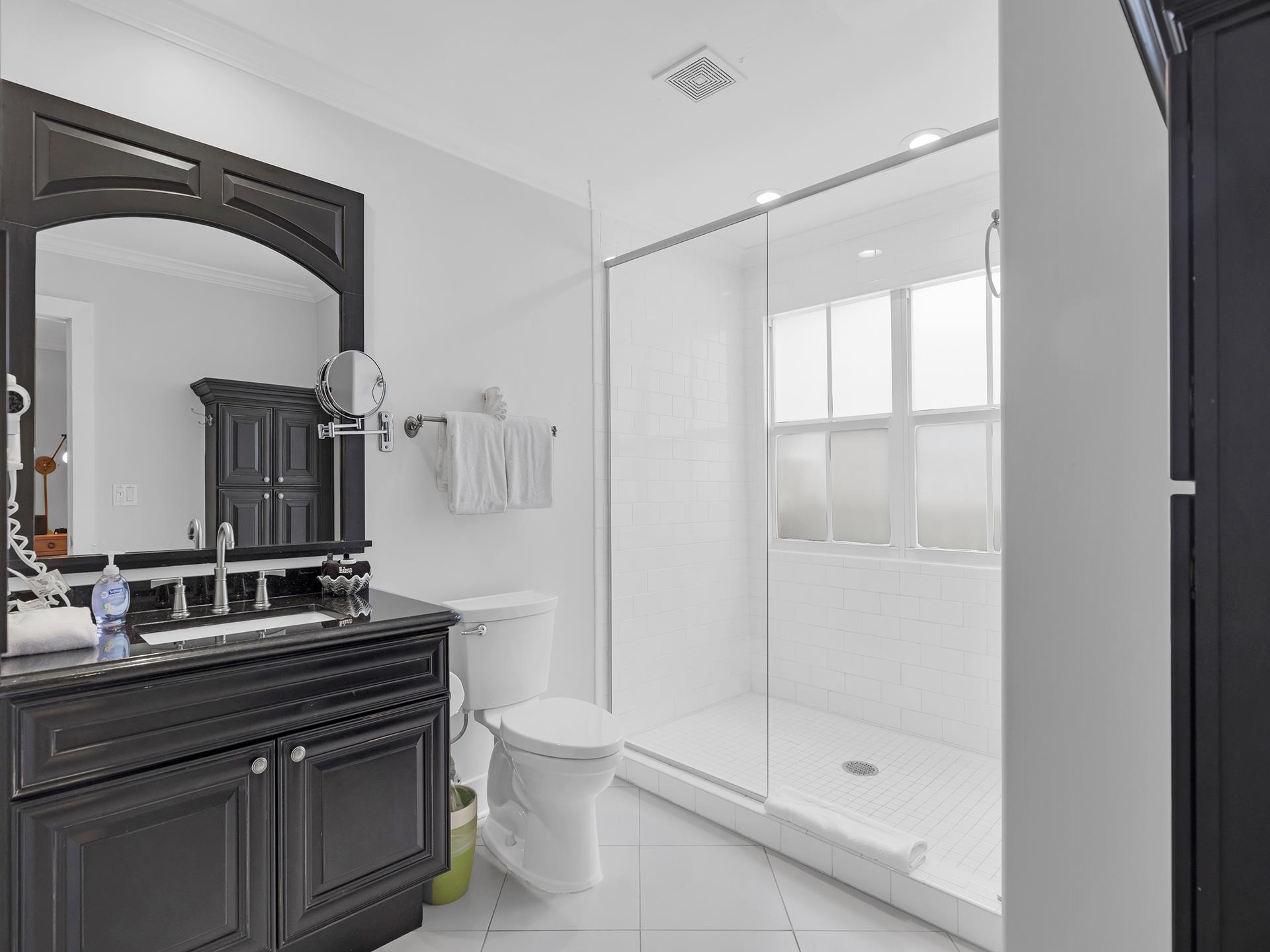 First floor ensuite bath with spacious walkin glass shower.