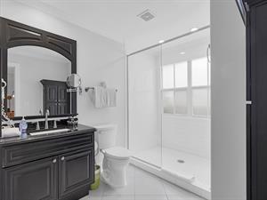 First floor ensuite bath with spacious walkin glass shower.