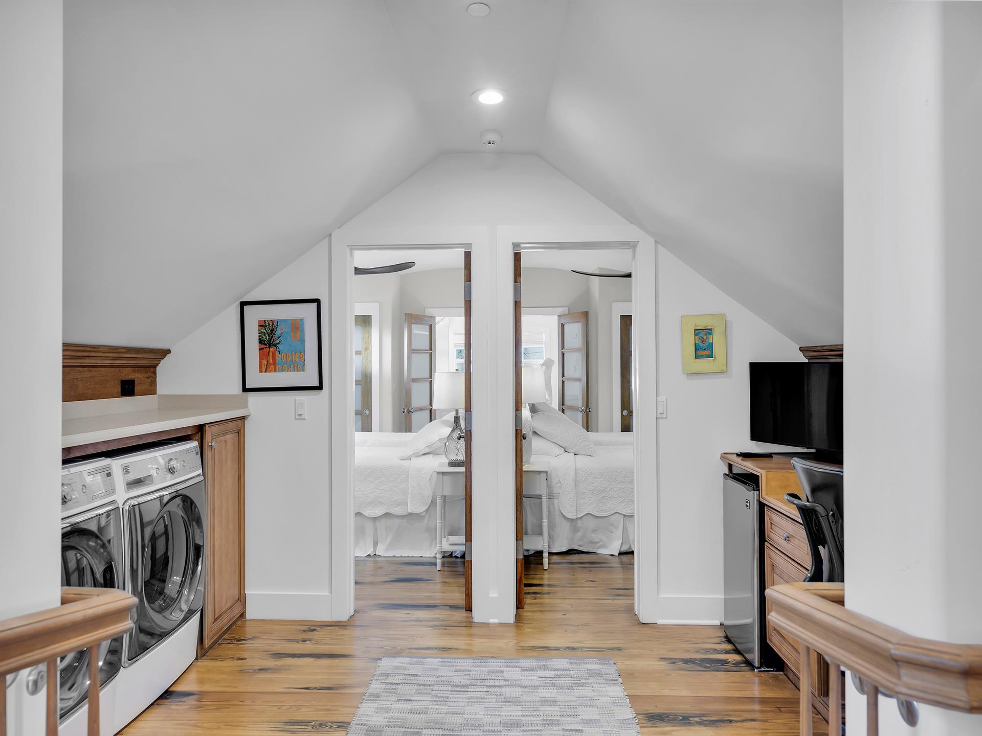 Upstairs youll find two Jack and Jill bedrooms just through the laundrywork station.