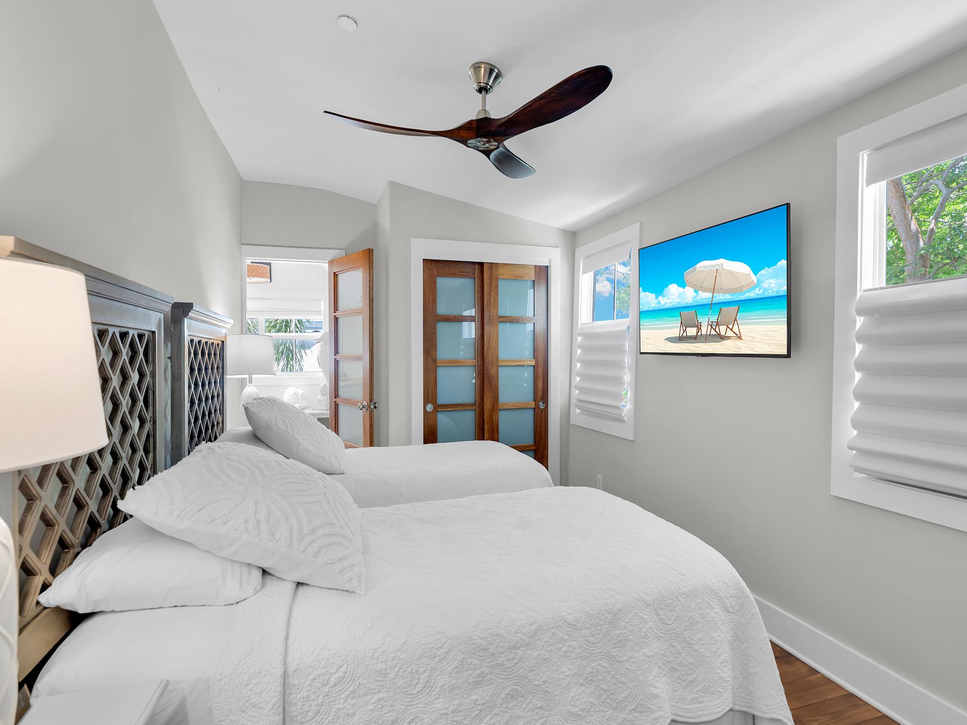 Twins or king with TV, closet and bedside lighting.