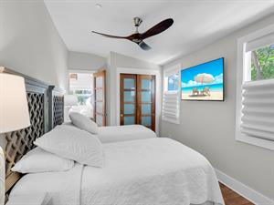 Twins or king with TV, closet and bedside lighting.