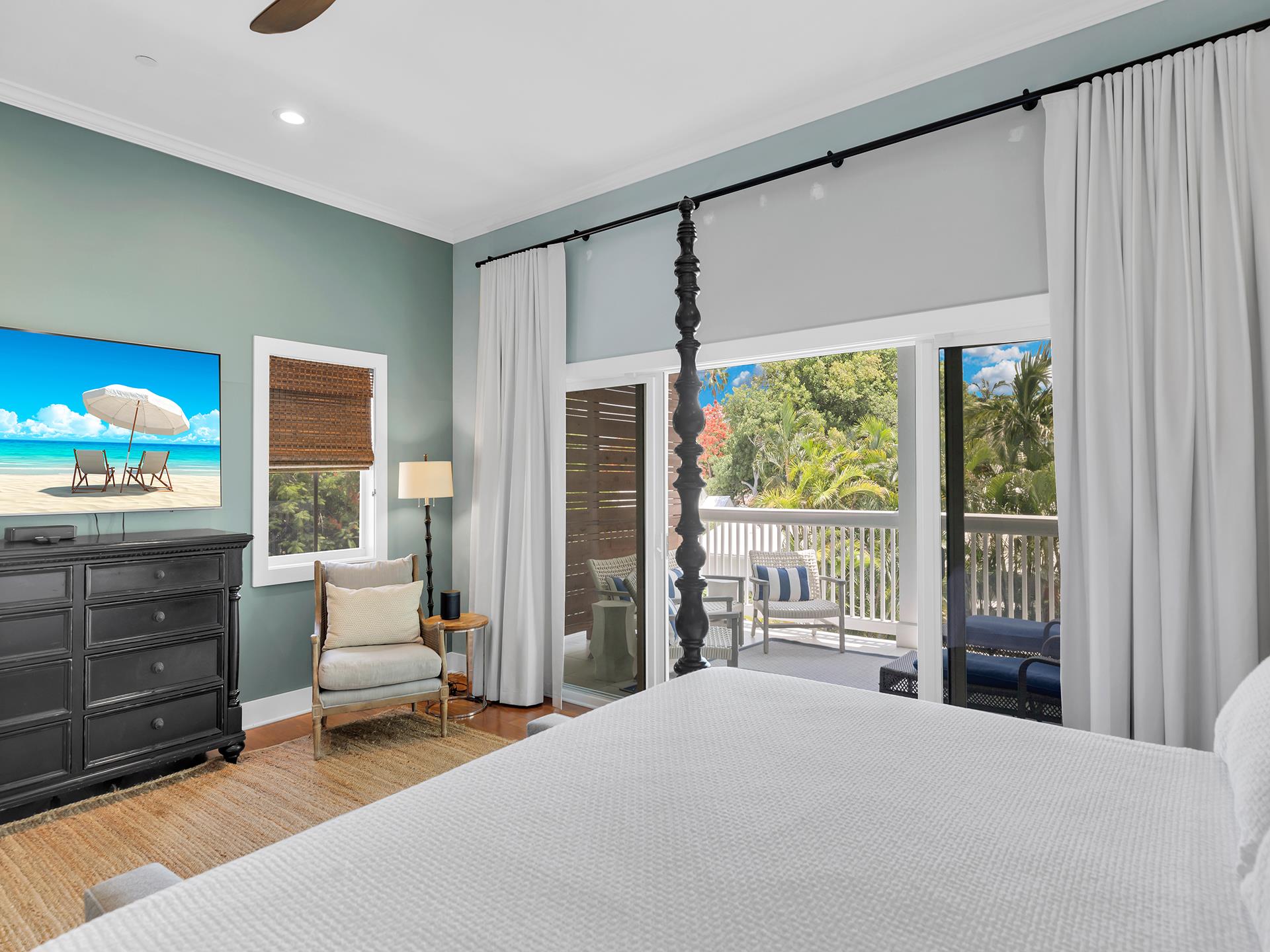 Primary king with dresser, TV and seating.