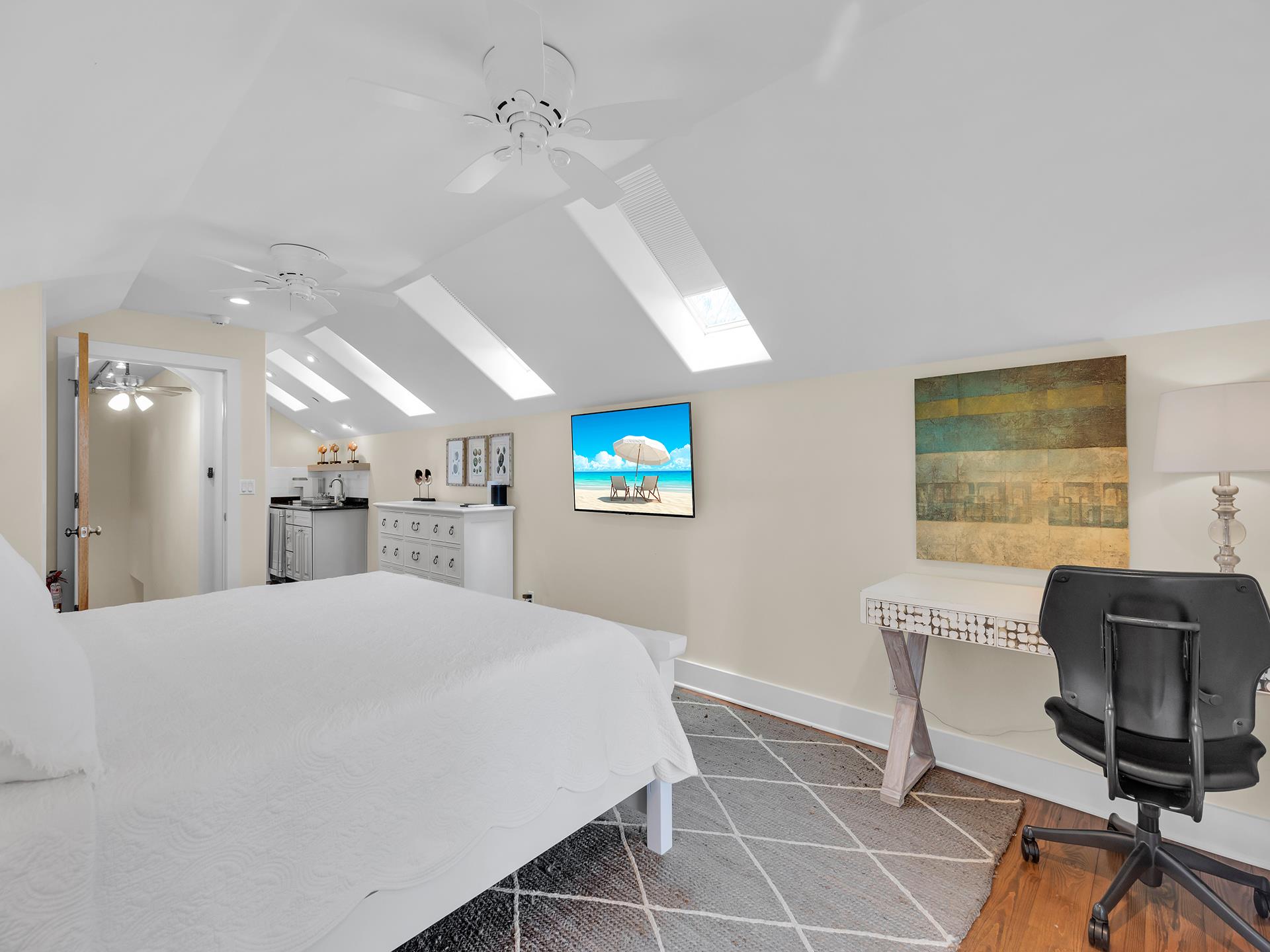 Third floor suite also has desk and sitting area.