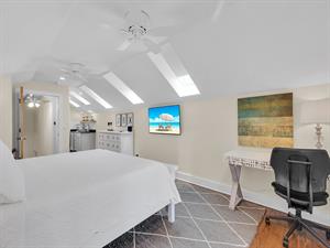 Third floor suite also has desk and sitting area.