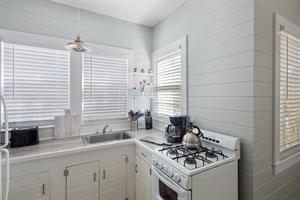 Kitchen includes coffee maker, stove, grill, oven, and toaster.