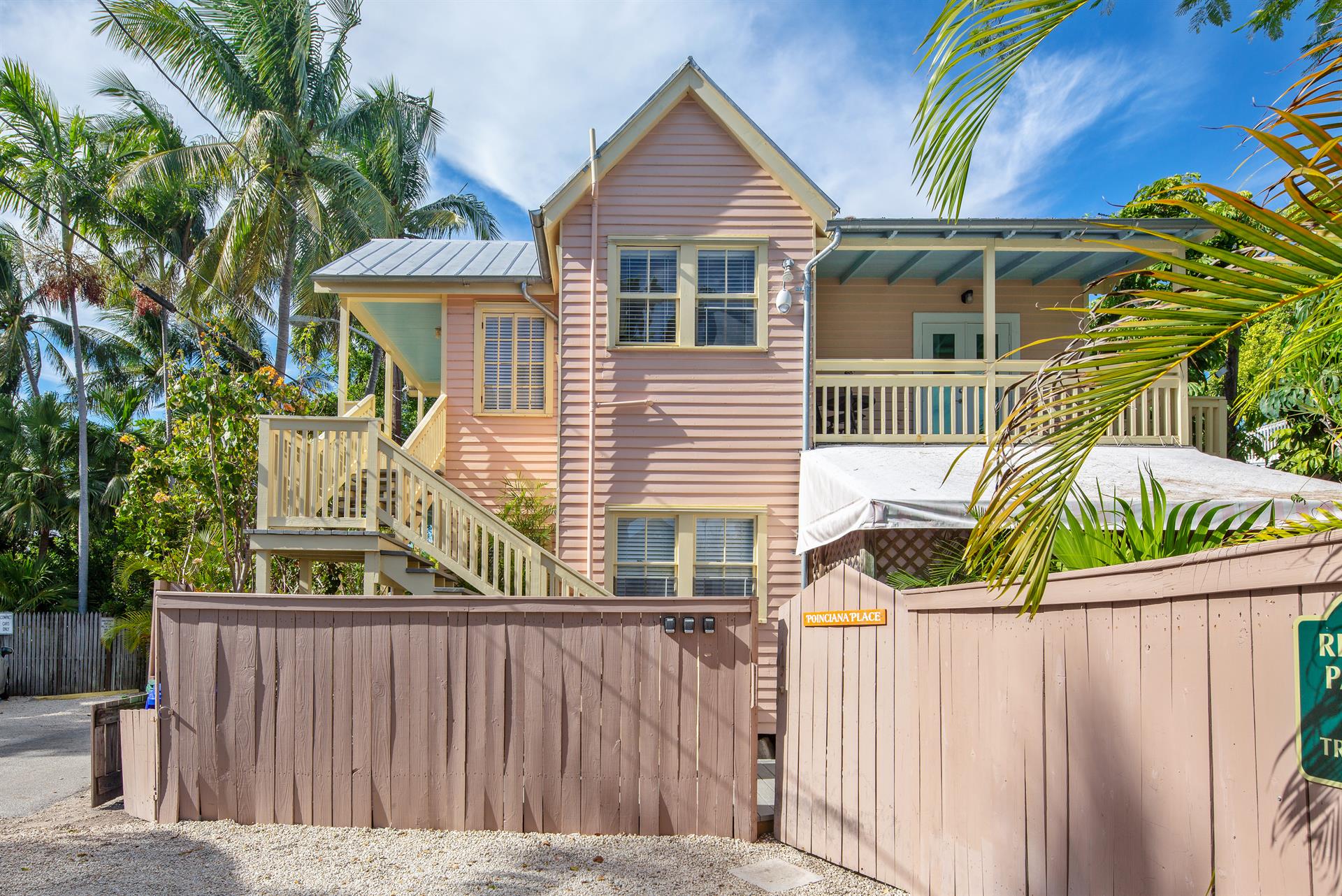 Parking area and gated front entrance.
