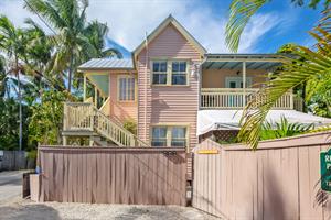 Parking area and gated front entrance.