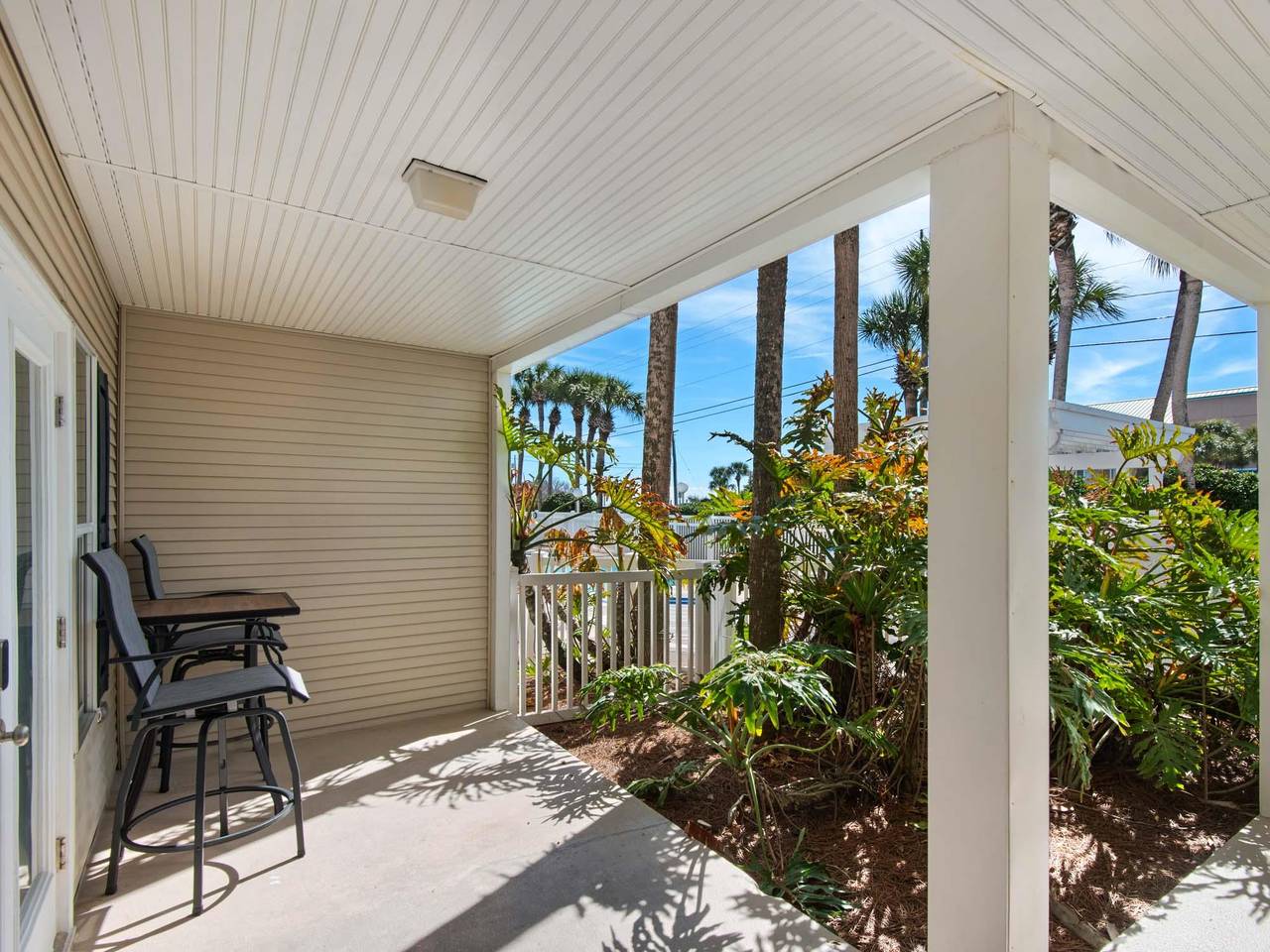 Relax on the private covered patio with comfortable seating for morning coffee or evening unwind.