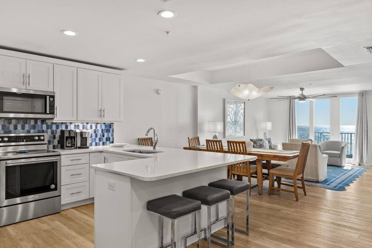 The openconcept kitchen flows into the dining and living areas.