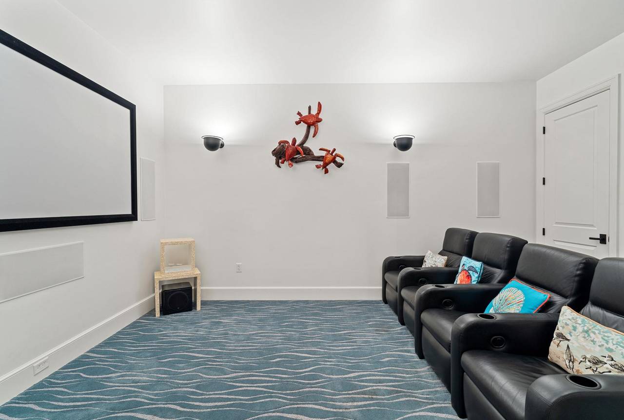 Relax with a movie in the comfort of 2110s private theater room.