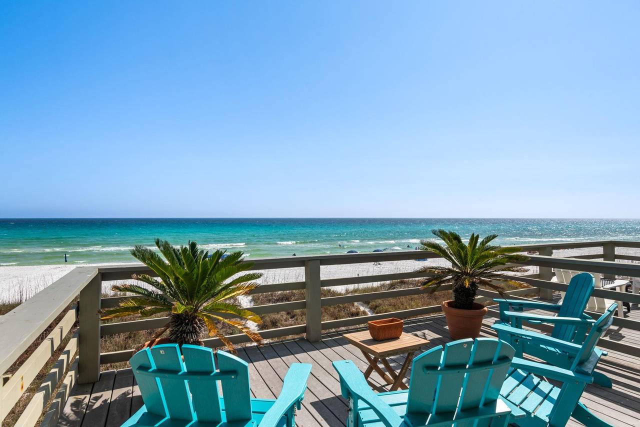 Relax in turquoise beach chairs on the private decks with stunning Gulf views