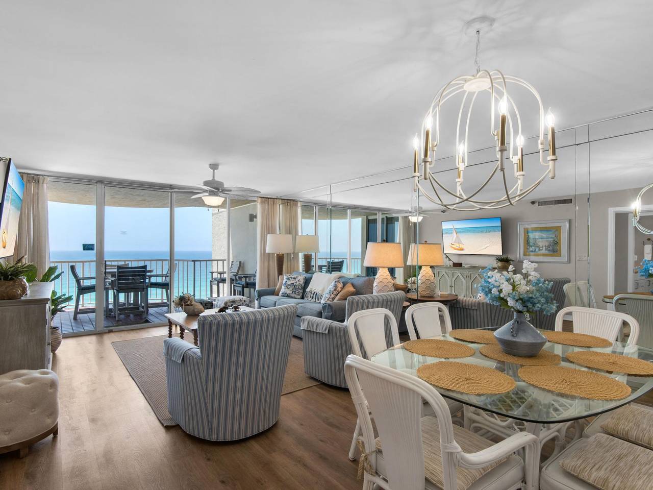 Unwind in your spacious living and dining area, where panoramic gulf views through floortoceiling glass doors frame every moment, blending coastal elegance with effortless comfort.