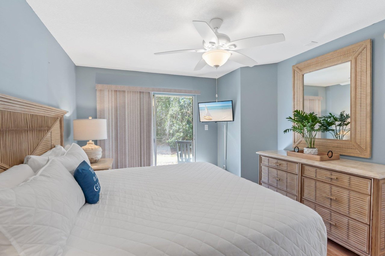 Primary Bedroom wit King Bed and Mounted TV