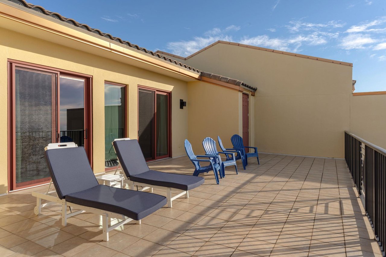 Soak up the sun on your private terrace with comfortable loungers and dining chairs, perfect for morning coffee or evening relaxation.