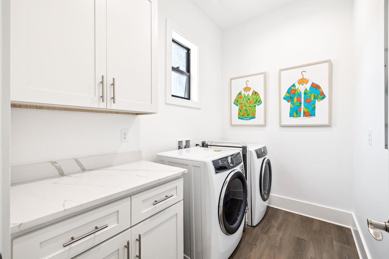 One of the dedicated laundry room makes staying fresh effortless with modern appliances and plenty of counter space for folding.