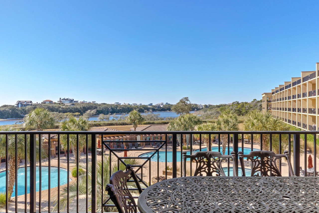 Your private balcony offers stunning pool and water views, perfect for morning coffee or evening relaxation with gentle breezes.