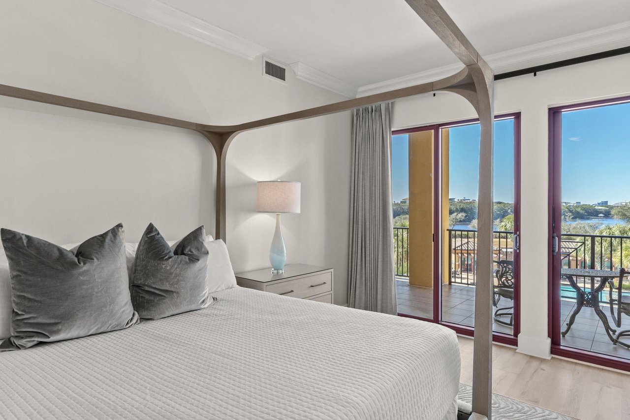 Wake up in your serene bedroom with gulf and lake views. Step onto your private balcony for morning coffee.