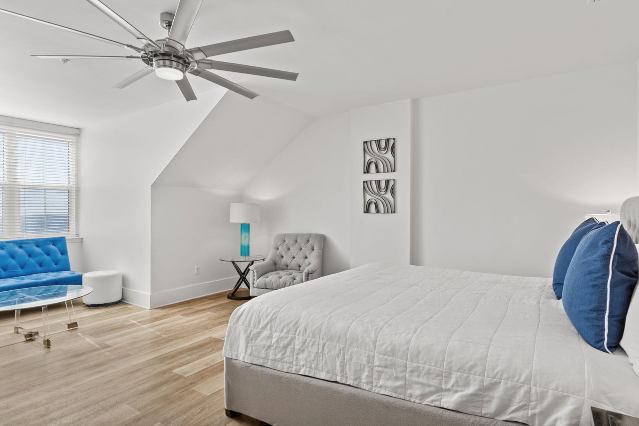 The King master suite also features a cozy reading chair.