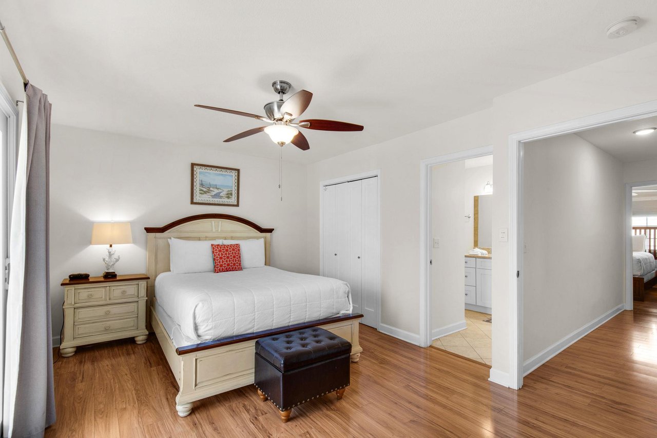 Located on the 2nd floor, bedroom 1 features wood floors, a ceiling fan and a private bathroom