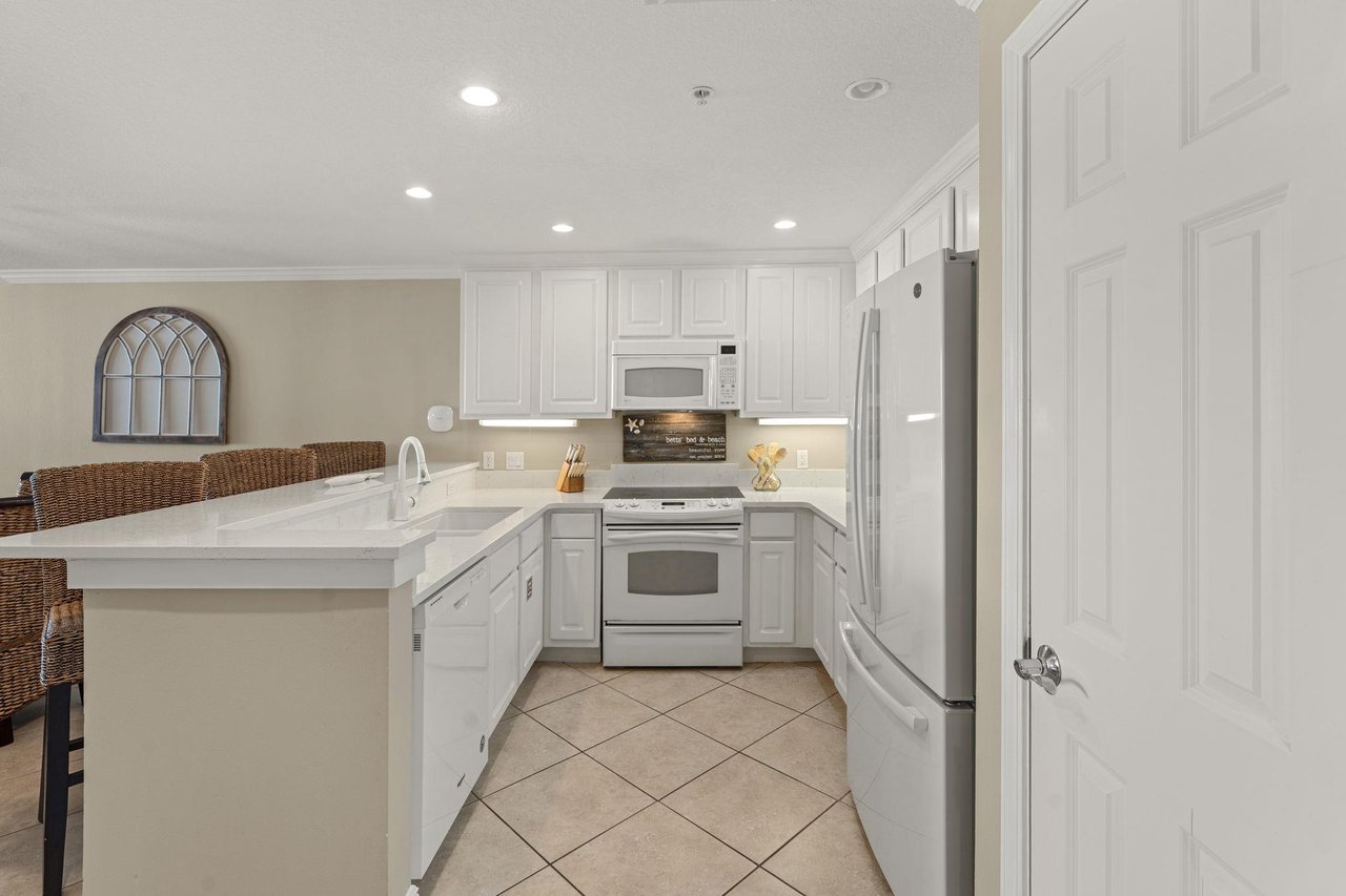 Cook your favorite meals in this bright, fullyequipped kitchen with modern appliances and plenty of counter space for prep work.