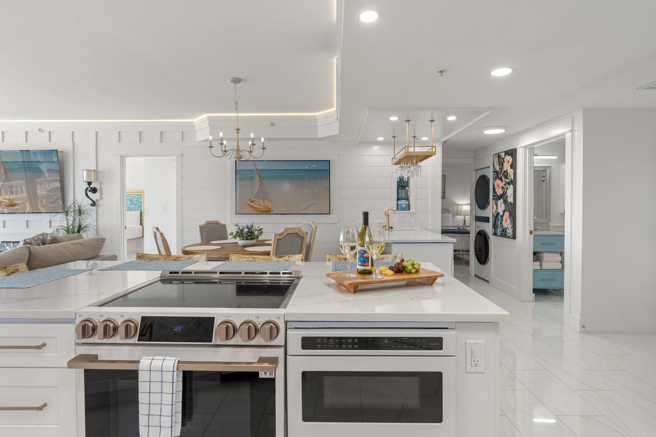 Step into your gourmet kitchen where marble countertops and premium appliances invite you to create culinary masterpieces.