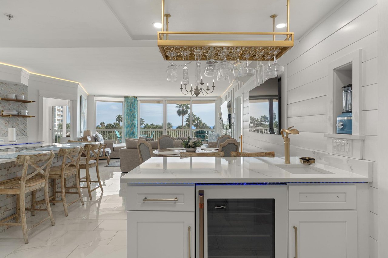 Relax in your bright, open kitchen flowing into the living space, with a great bar area.