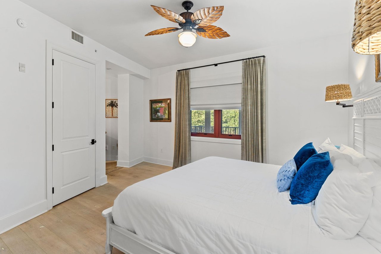 Bedroom 2 offers a king bed, private bathroom, and direct access to a comfortable sitting area.