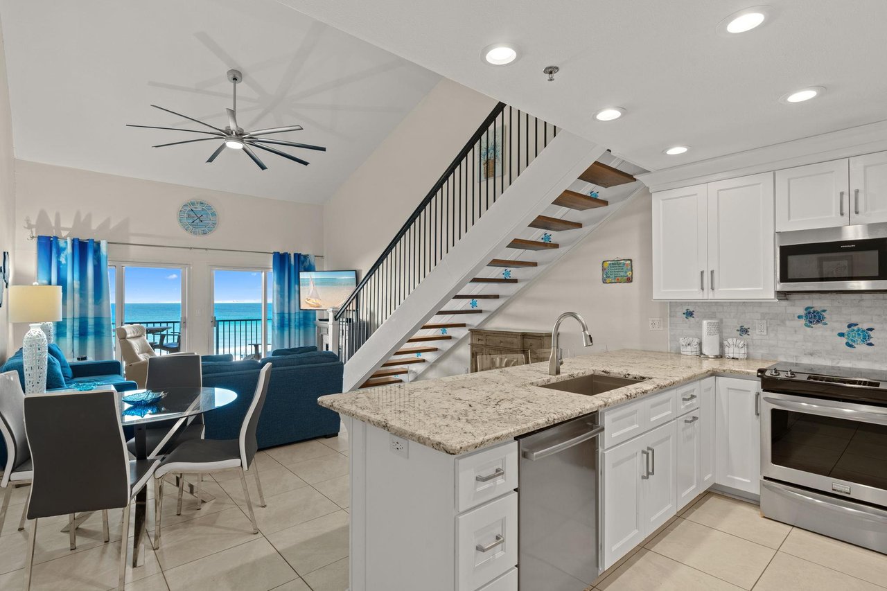 Unwind in your bright, openconcept living space where the modern kitchen flows into a cozy lounge area, all framed by stunning ocean views youll enjoy every day.