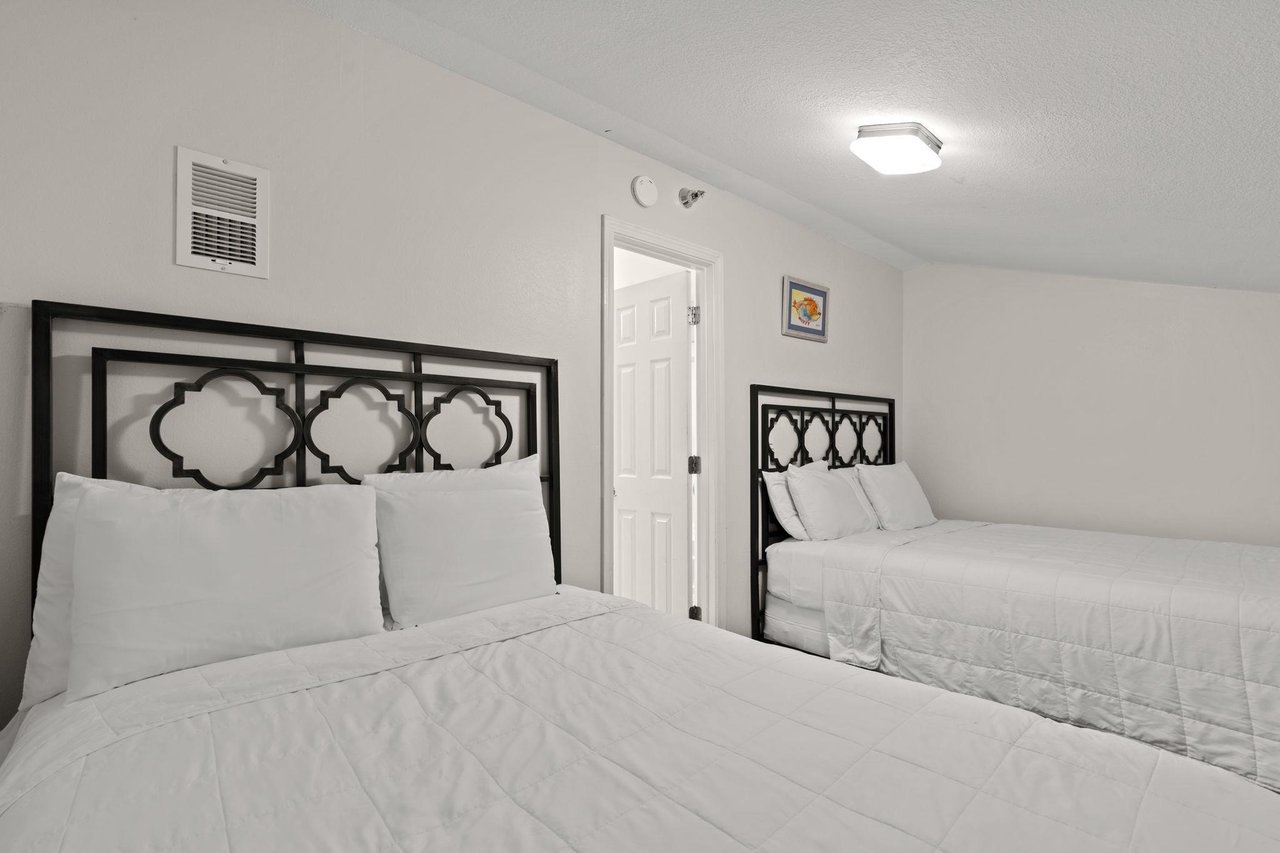 2nd floor LOFT bedroom 3 with queen and double bed with privacy door  walk thru king loft area to access this room