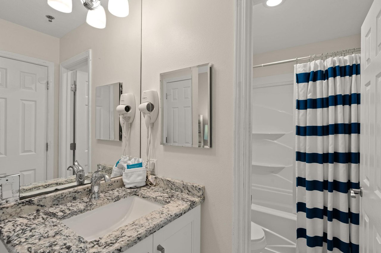 2nd floor LOFT shared bathroom with open vanity area, door for privacy in shower and toilet room