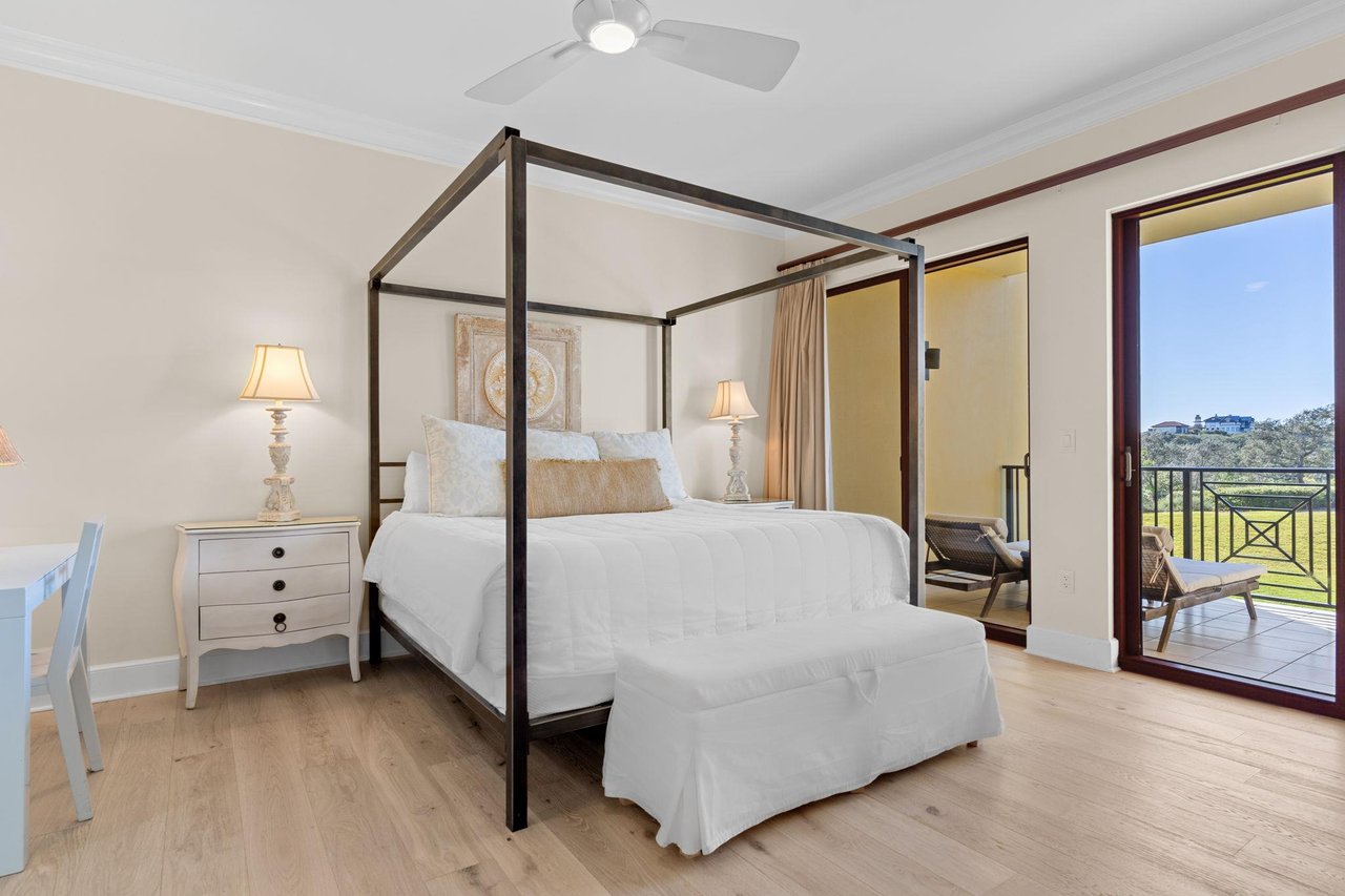 Bedroom 1 with King Bed and Private Balcony Access